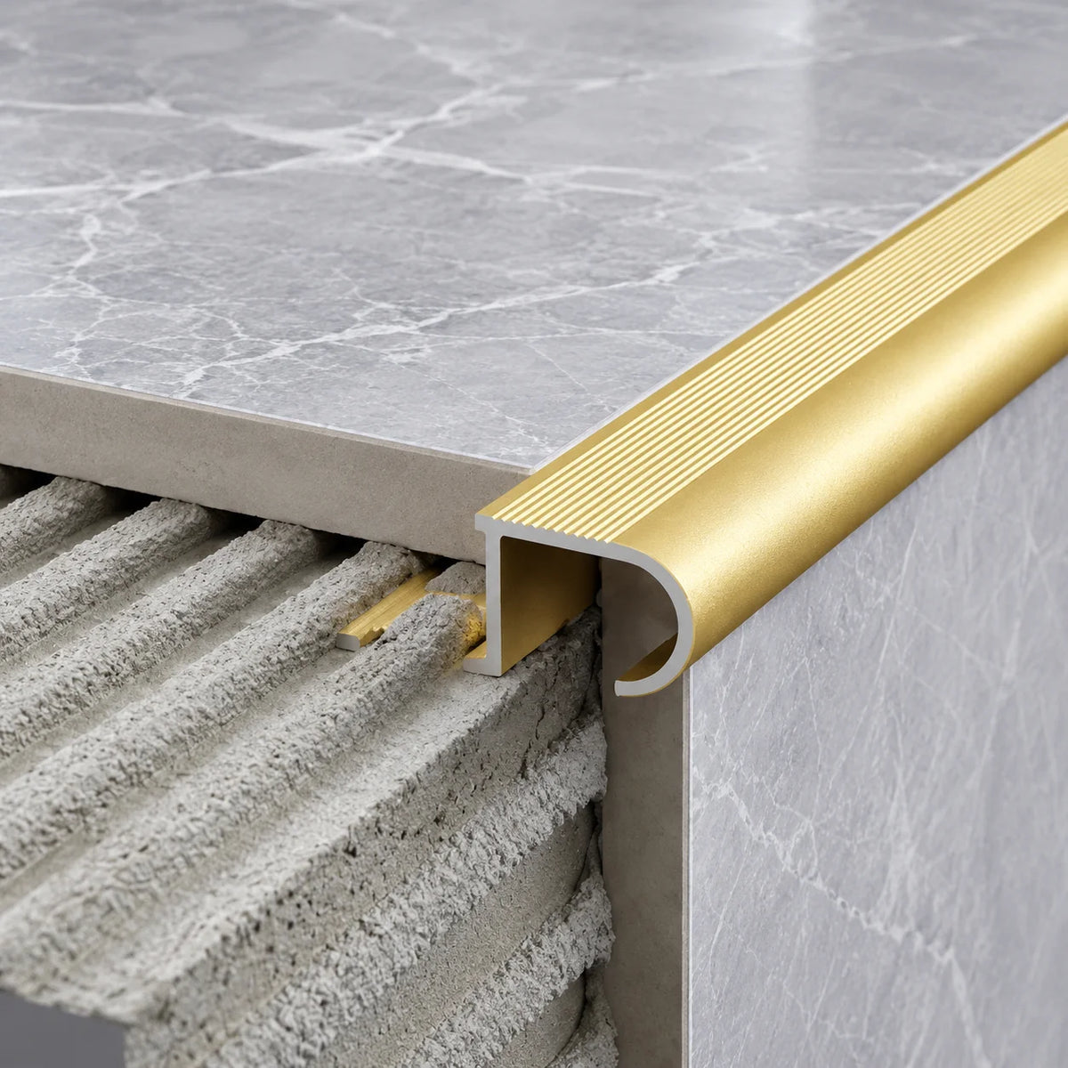 Premium 34x11x10mm Aluminium Stair Edge Trim with a 2.5m Length, Featuring a Tile-In Installation Design for a Seamless Transition Between Stair Treads and Edges.