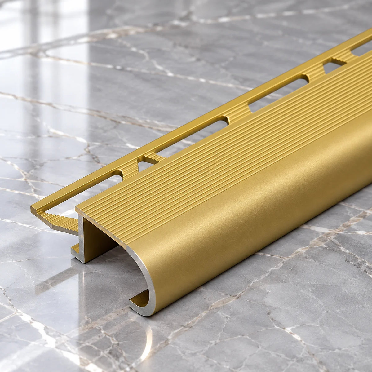 Professional Aluminium Tile-In Stair Nosing with a Precision-Designed 34x11x10mm Profile, Providing a Clean and Decorative Finish to Residential and Commercial Tiled Staircases.