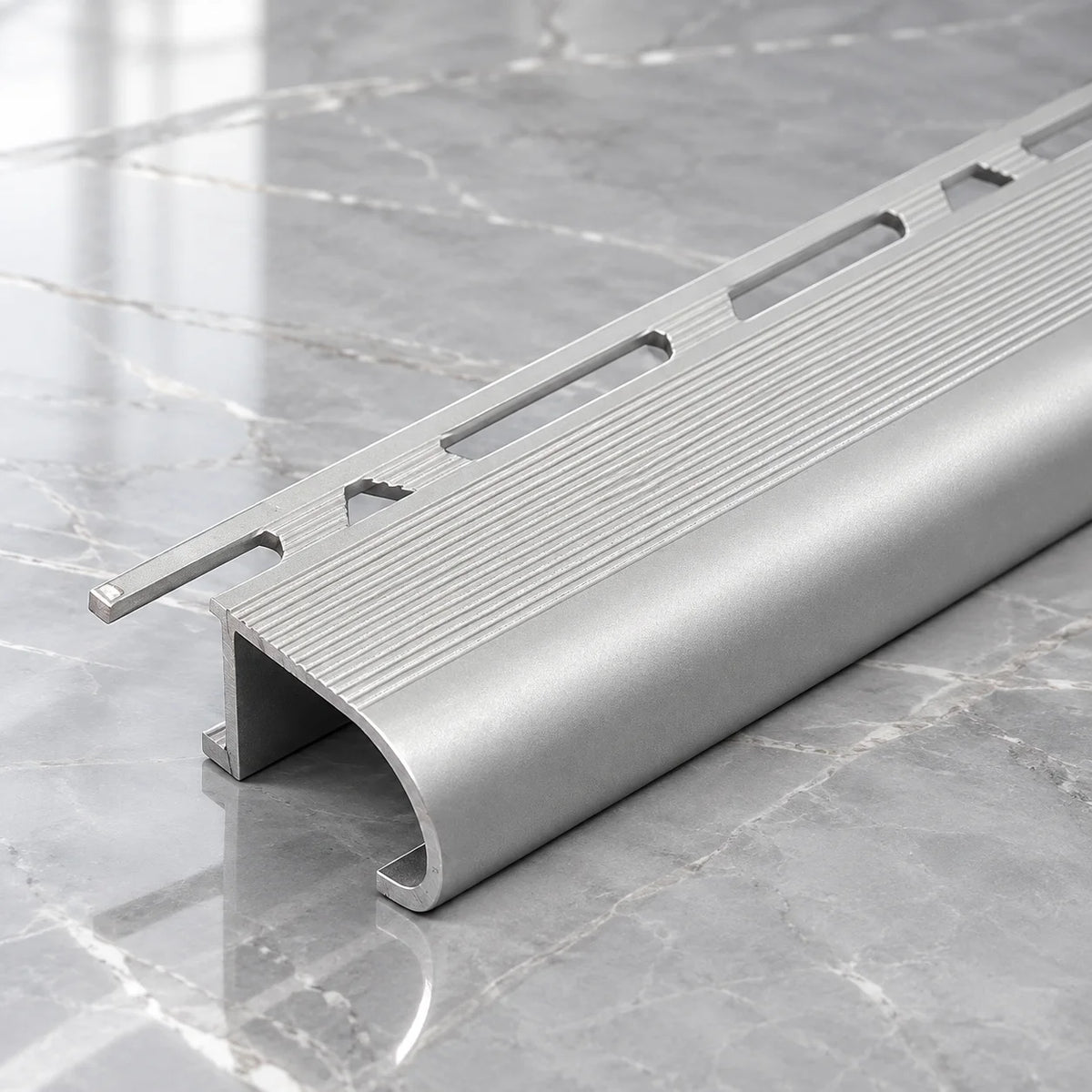 Modern Aluminium Tile-In Stair Nosing Profile Designed for Ceramic, Porcelain and Other Suitable Tiled Staircases, Offering Durable Stair Edge Protection and a Stylish Architectural Finish.