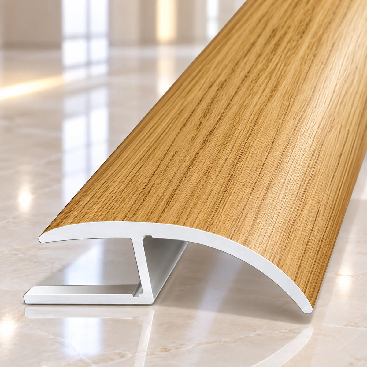 40mm wood effect aluminium floor transition profile designed to provide a smooth and professional finish between adjoining flooring surfaces.