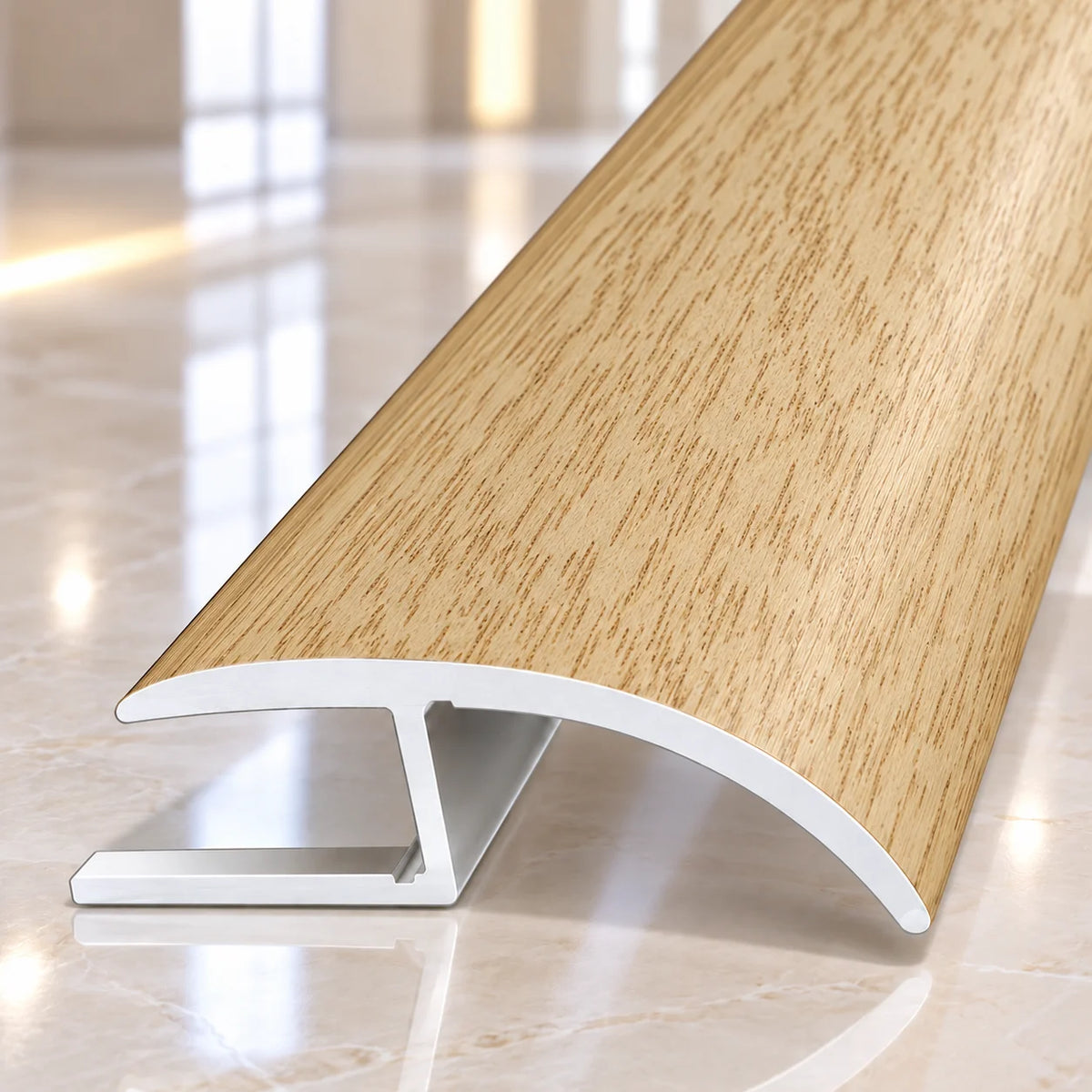 Premium 40mm aluminium floor transition strip featuring a realistic wood grain finish for seamless connections between laminate and wooden floors.