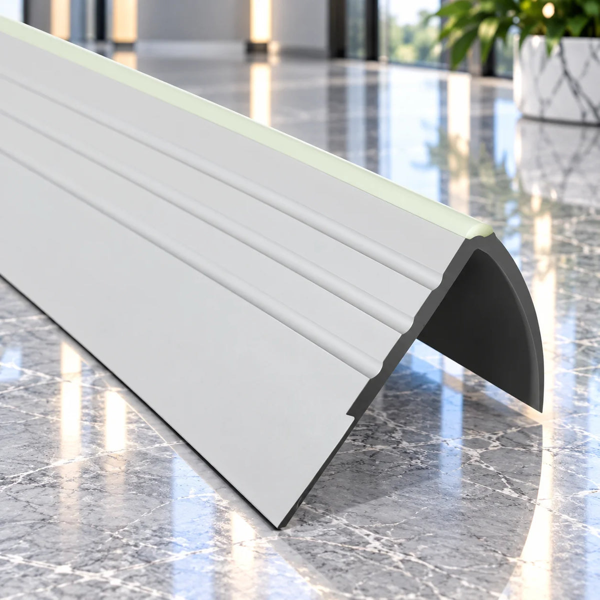 1.2m 40x40mm Luminescent PVC Stair Edge Trim providing a durable and highly visible finish for indoor stair edges.