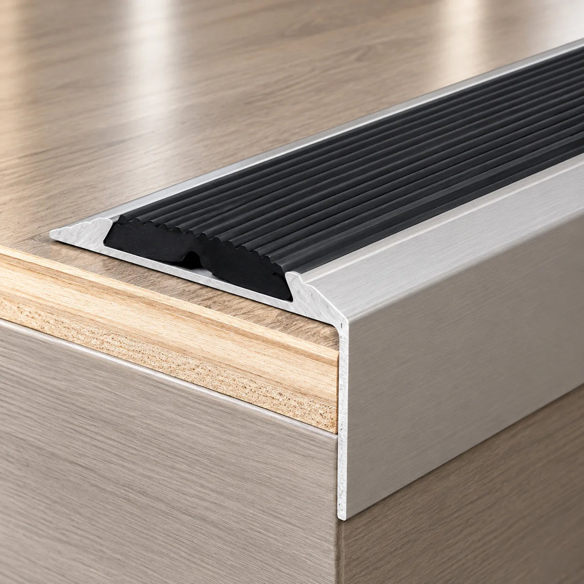 Easy-to-install aluminium stair edging strip with a slip-resistant walking surface and self-adhesive fixing for secure stair edge coverage.