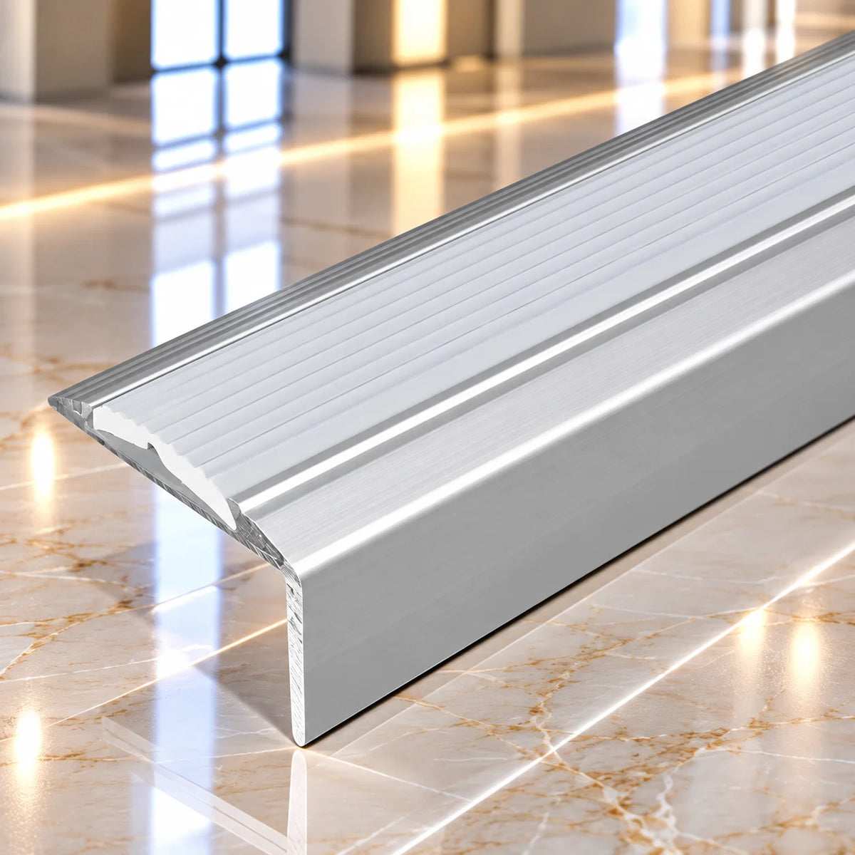 Heavy-duty self-adhesive aluminium stair edging profile designed for easy installation without drilling, providing a professional staircase finish.
