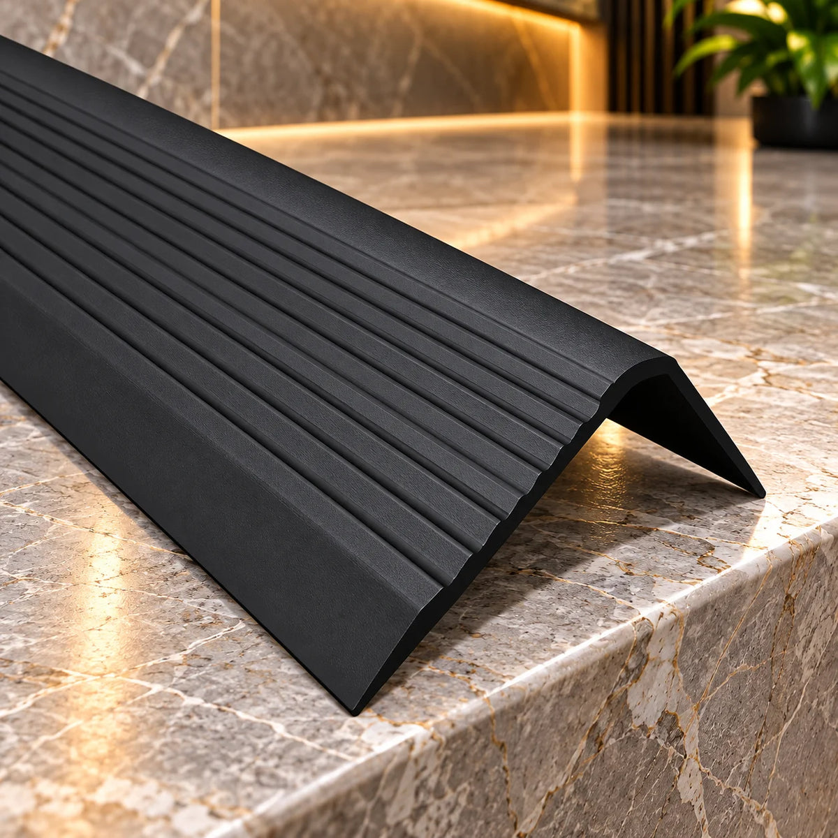 Heavy-duty flexible PVC stair nosing with a 70mm horizontal tread and 40mm vertical riser, featuring a slip-resistant surface for secure footing.