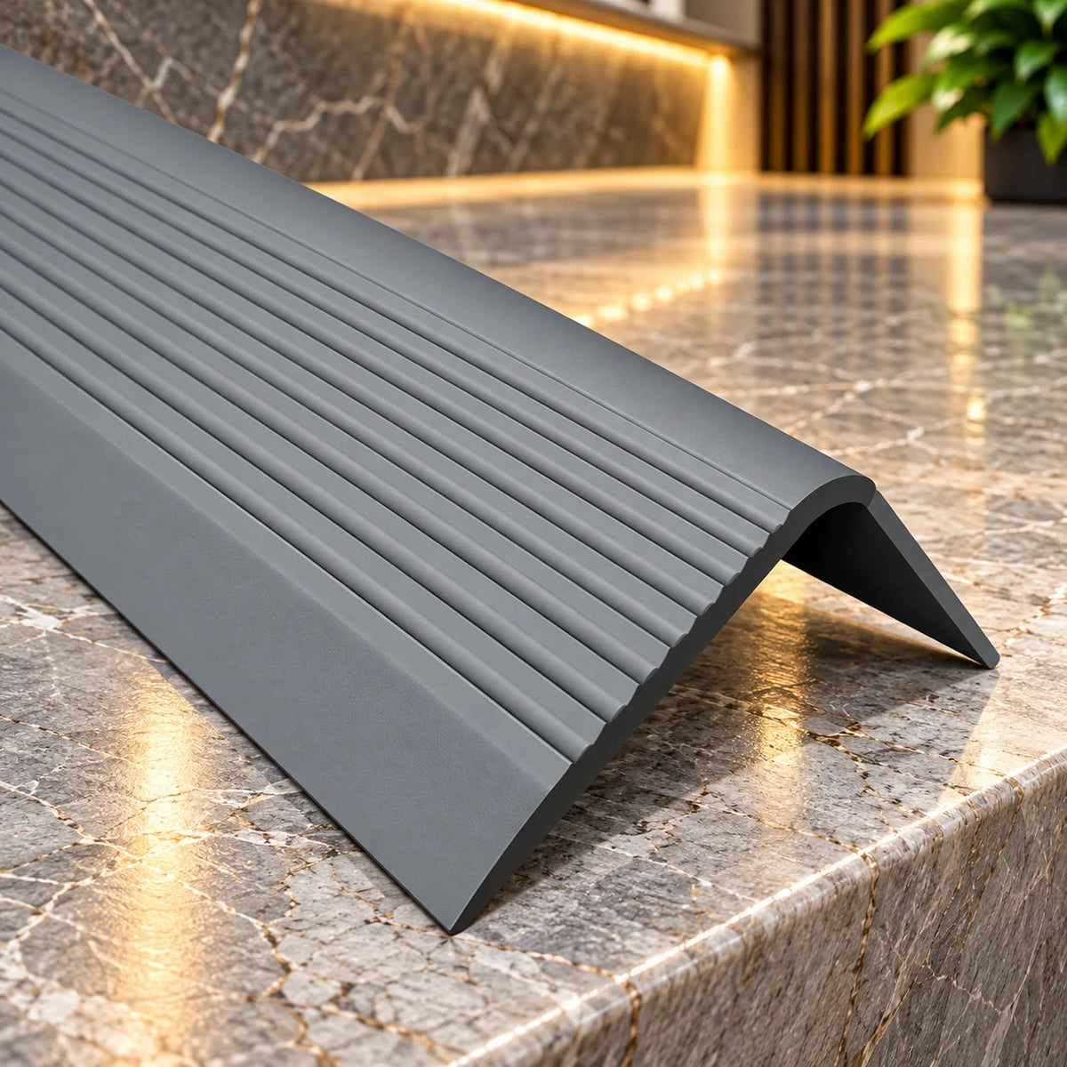 Close-up view of 70x40mm flexible PVC stair nosing highlighting its textured non-slip tread surface and durable protective stair edge design.