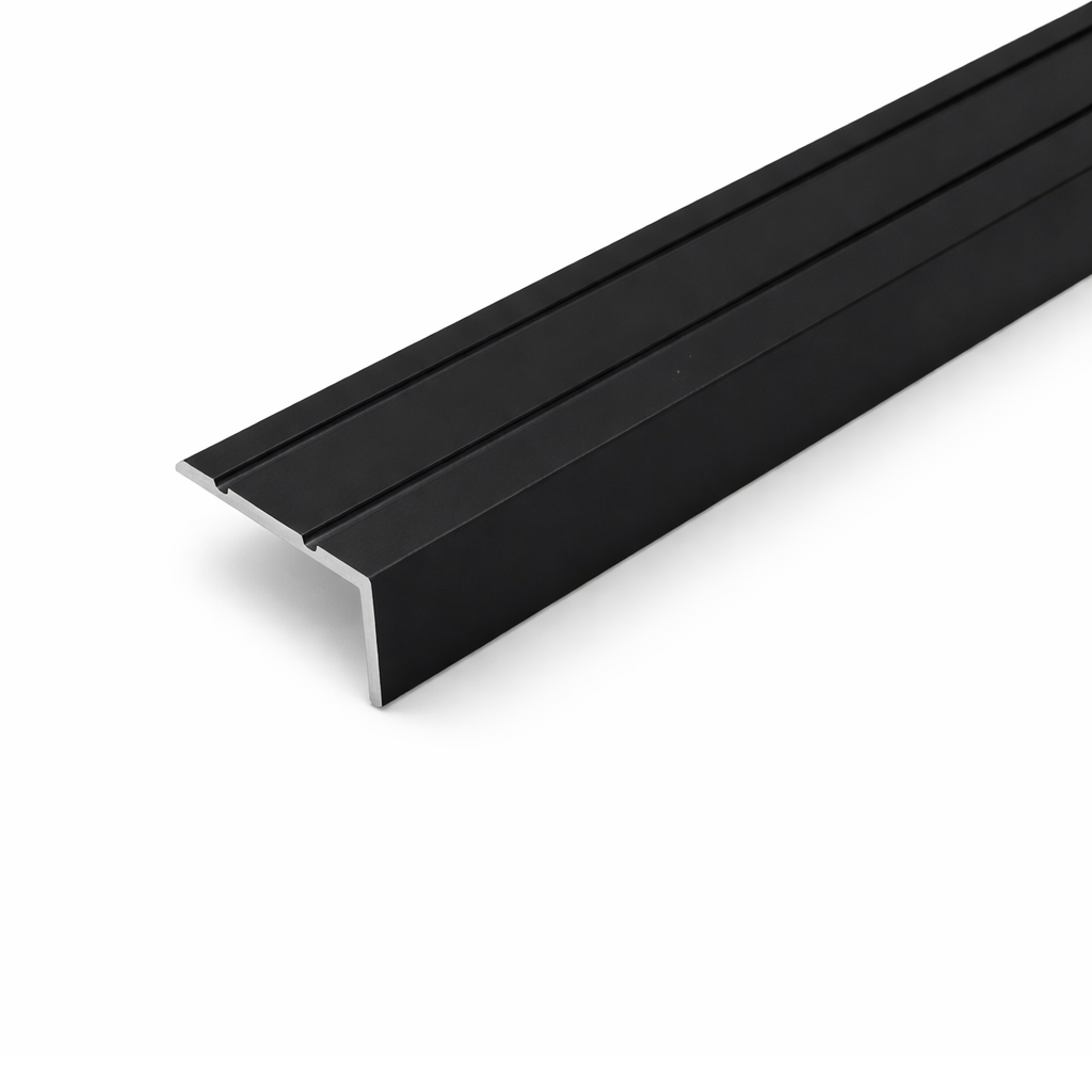 Black A31 25x10mm anodised aluminium self adhesive stair nosing edge trim installed on indoor staircase for slip protection