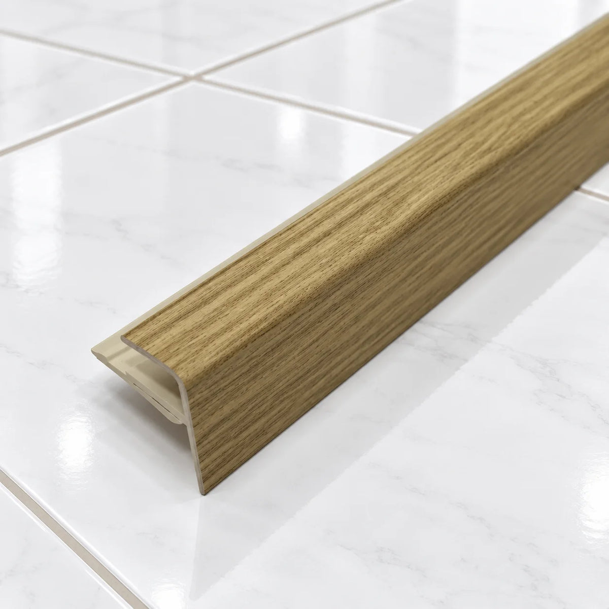 D-K0600 16x25mm Push-In PVC Stair Nosing In Elm 5e