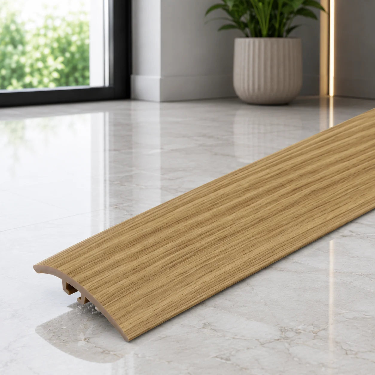 Wood effect 30mm PVC threshold strip for joining different flooring surfaces.