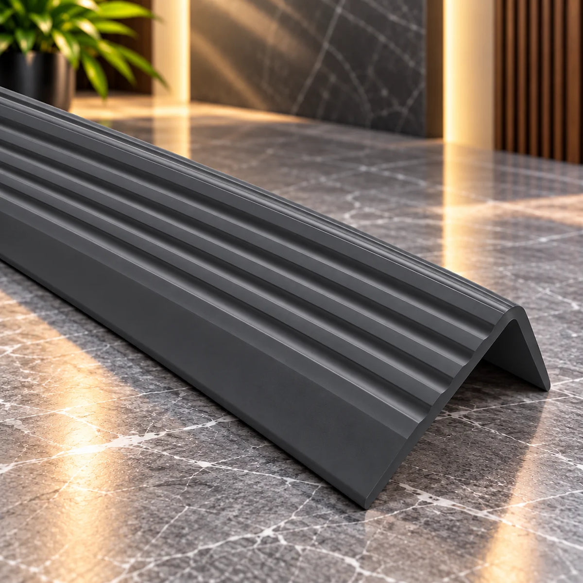 Close-up view of 40x25mm flexible self-adhesive stair nosing showing its textured non-slip surface and protective stair edge design.