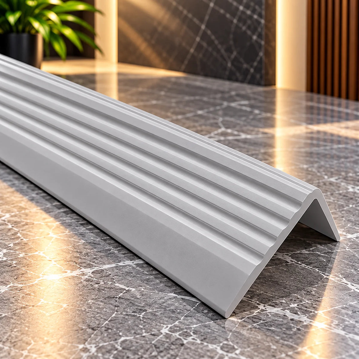 Professional 40x25mm self-adhesive stair edge trim featuring a flexible construction and slip-resistant tread for improved staircase safety.