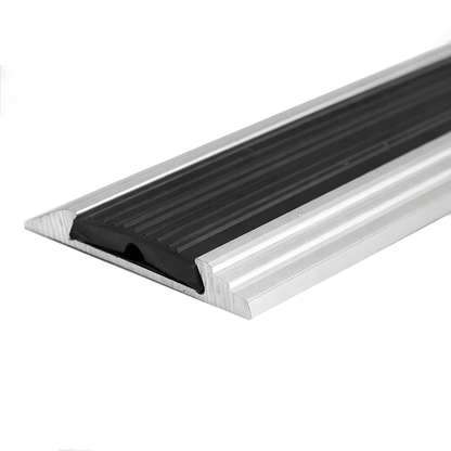 Silver A10 anodised aluminium flat non-slip threshold strip installed between two floor surfaces for added safety.