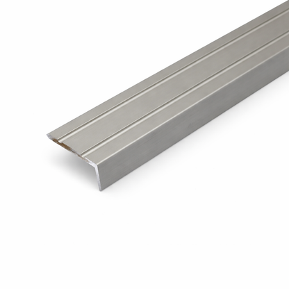 Inox A31 25x10mm anodised aluminium self adhesive stair nosing edge trim installed on indoor staircase for slip protection