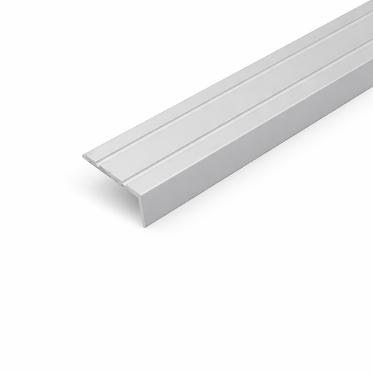 Silver A31 25x10mm anodised aluminium self adhesive stair nosing edge trim installed on indoor staircase for slip protection