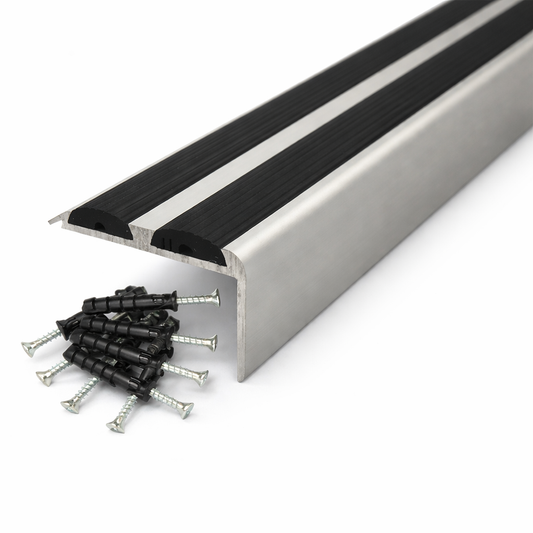 Silver Anodised aluminium stair nosing with rubber inserts installed on staircase step