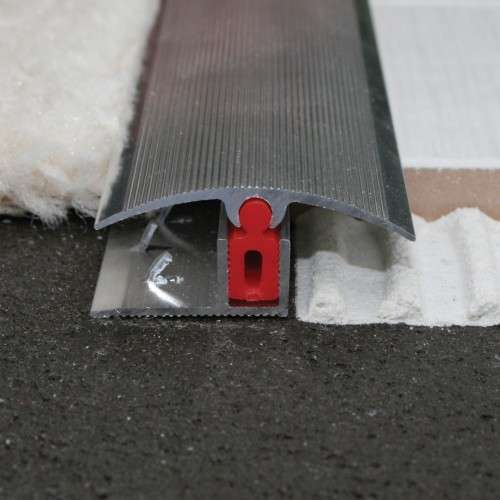 An aluminium door threshold strip with a carpet cover, showing the easy clip system for installation.