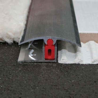 An aluminium door threshold strip with a carpet cover, showing the easy clip system for installation.
