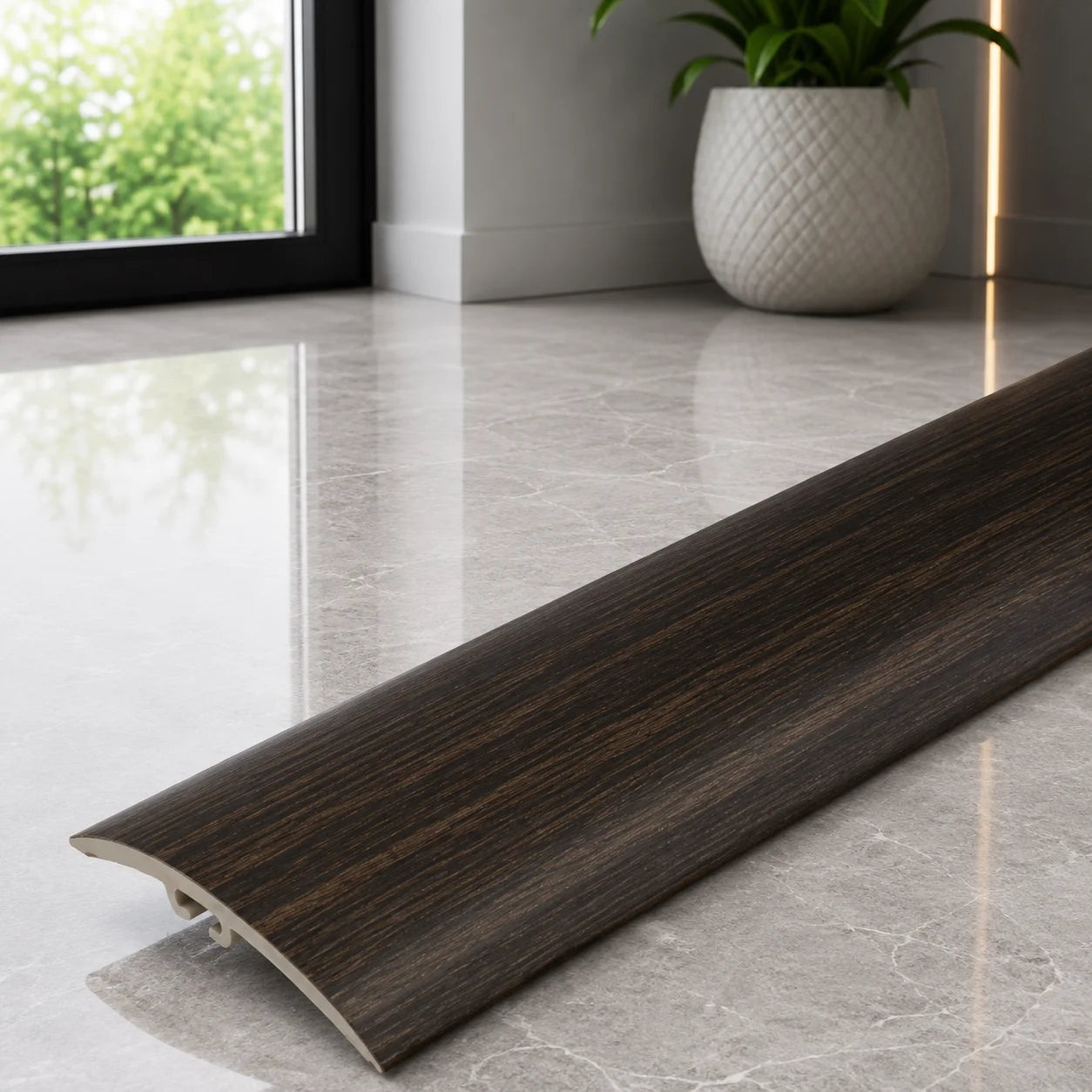 30mm PVC flooring threshold strip with decorative wood effect finish.